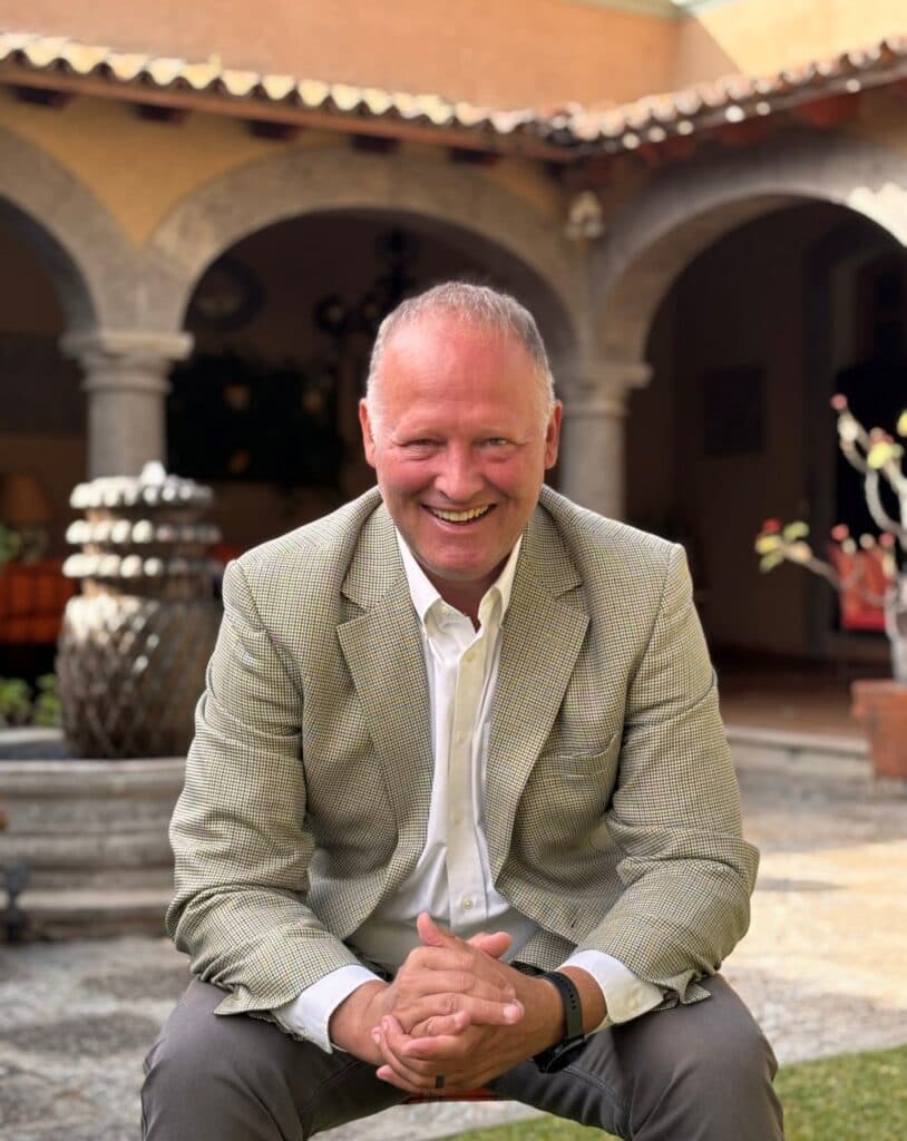 John C. Rounds seated in a courtyard in Ajijic, Mexico